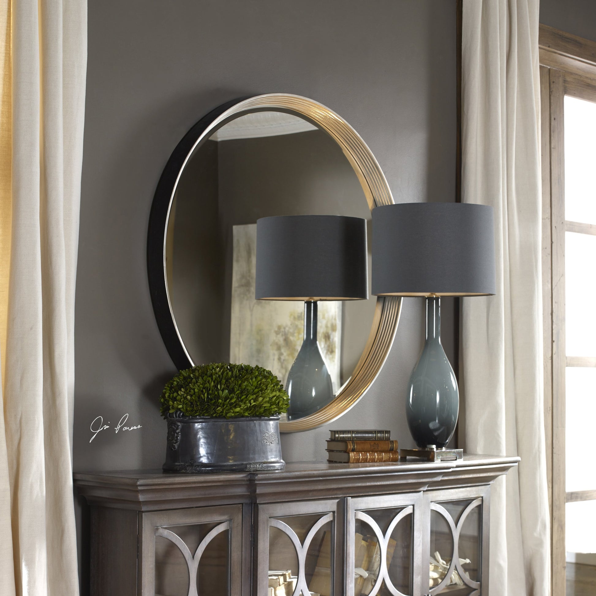Serenza Mirror by Uttermost in silver. Made from pu leather, mdf, glass in a modern style.