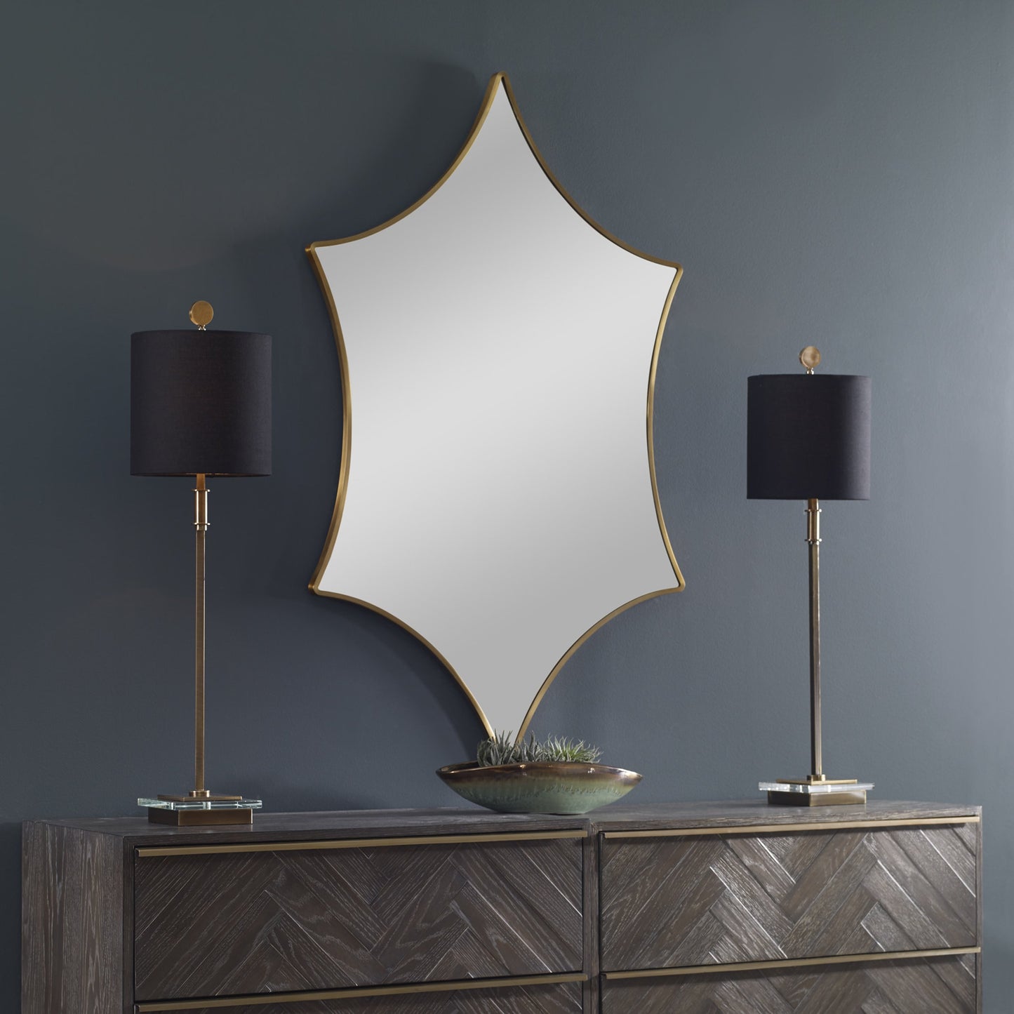 004 SR-824133 | Lifestyle | Aries Mirror by Uttermost in gold. Made from stainless steel, mdf, glass in a transitional style.