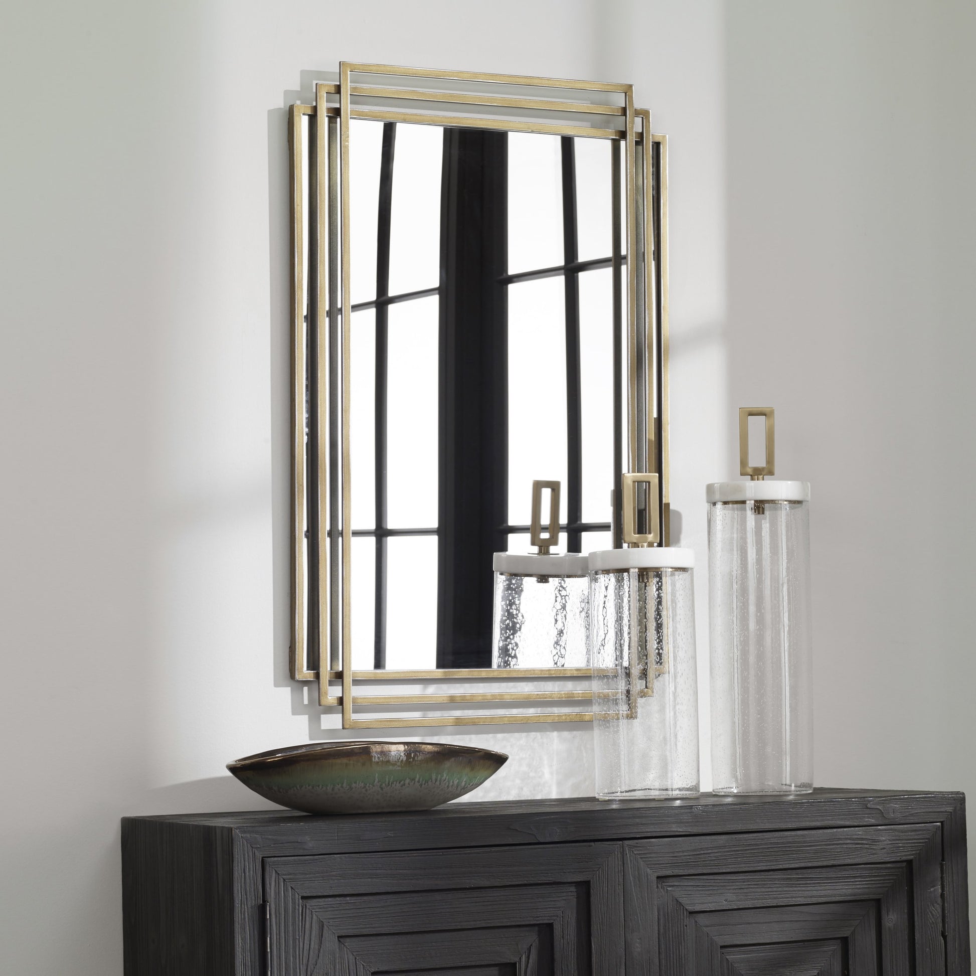 Amherst Brushed Mirror by Uttermost in gold. Made from iron, mdf, mirror in a transitional style.