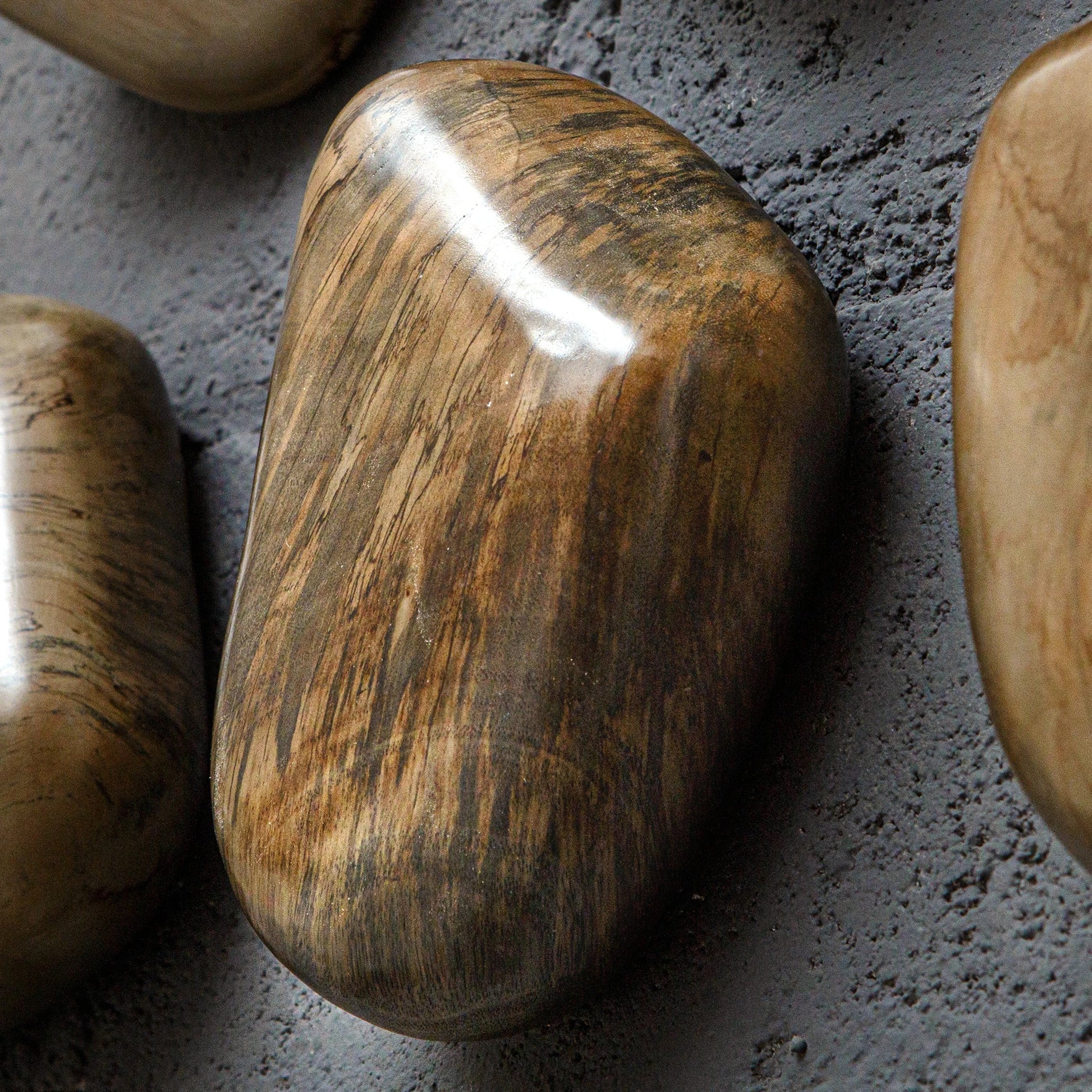 Pebbles Wall Decor by Uttermost. Made from tamarind wood in a modern style.