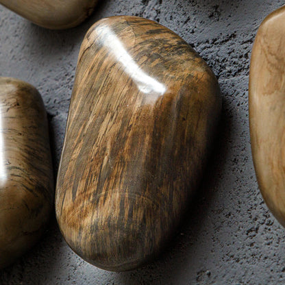 Pebbles Wall Decor by Uttermost. Made from tamarind wood in a modern style.