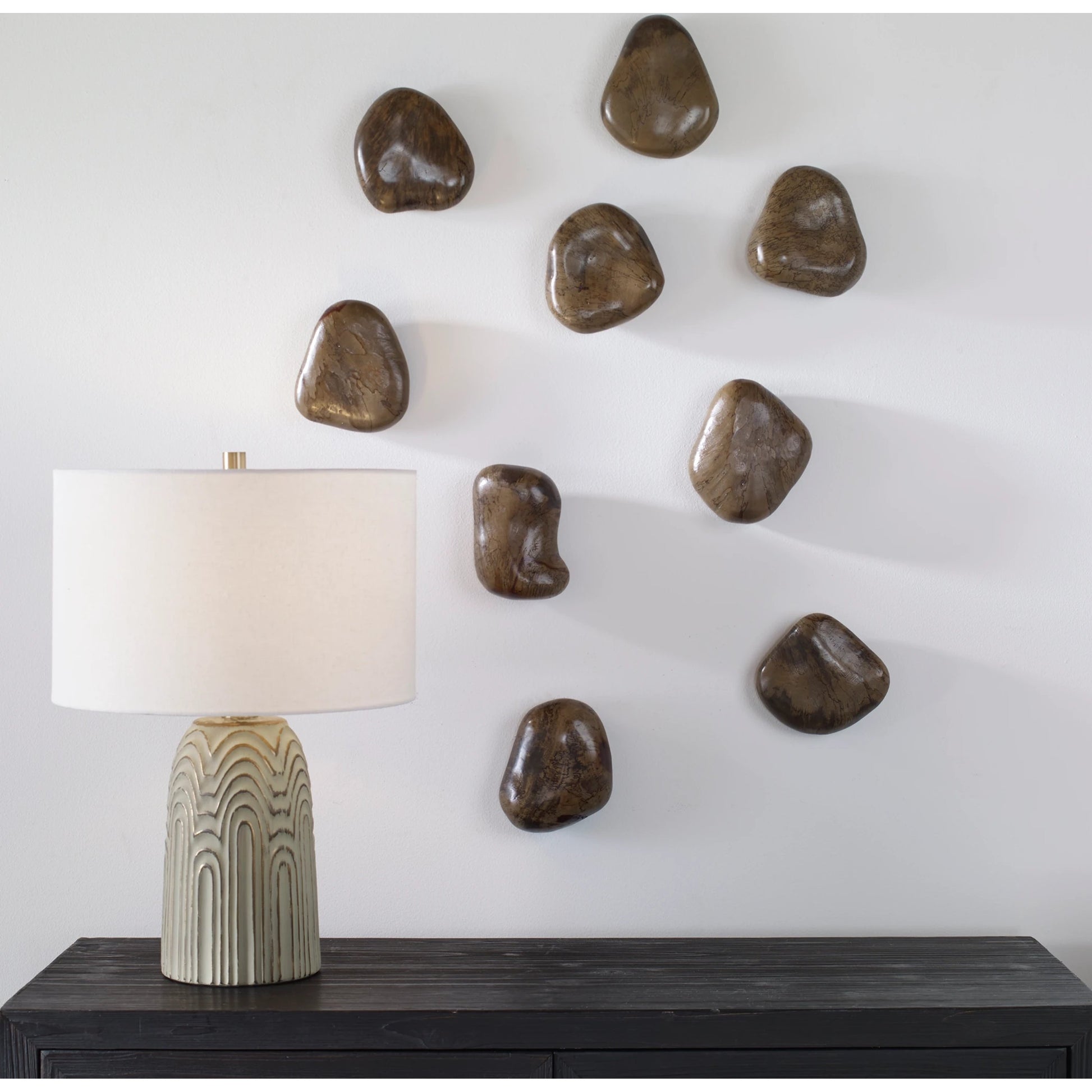 Pebbles Wall Decor by Uttermost. Made from tamarind wood in a modern style.