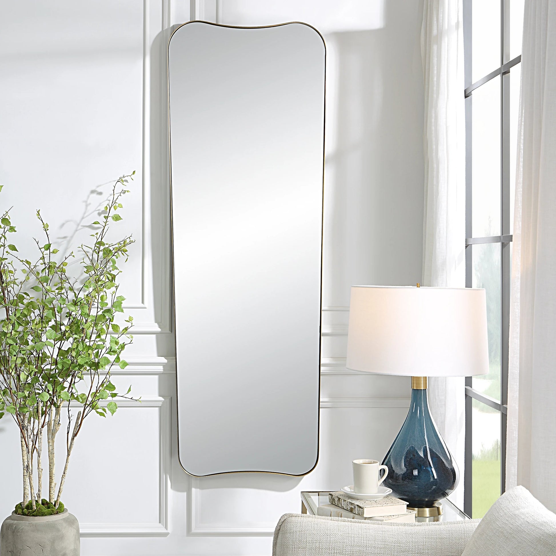 Belvoir Large Mirror by Uttermost in brass. Made from stainless steel, mdf, glass in a modern style.