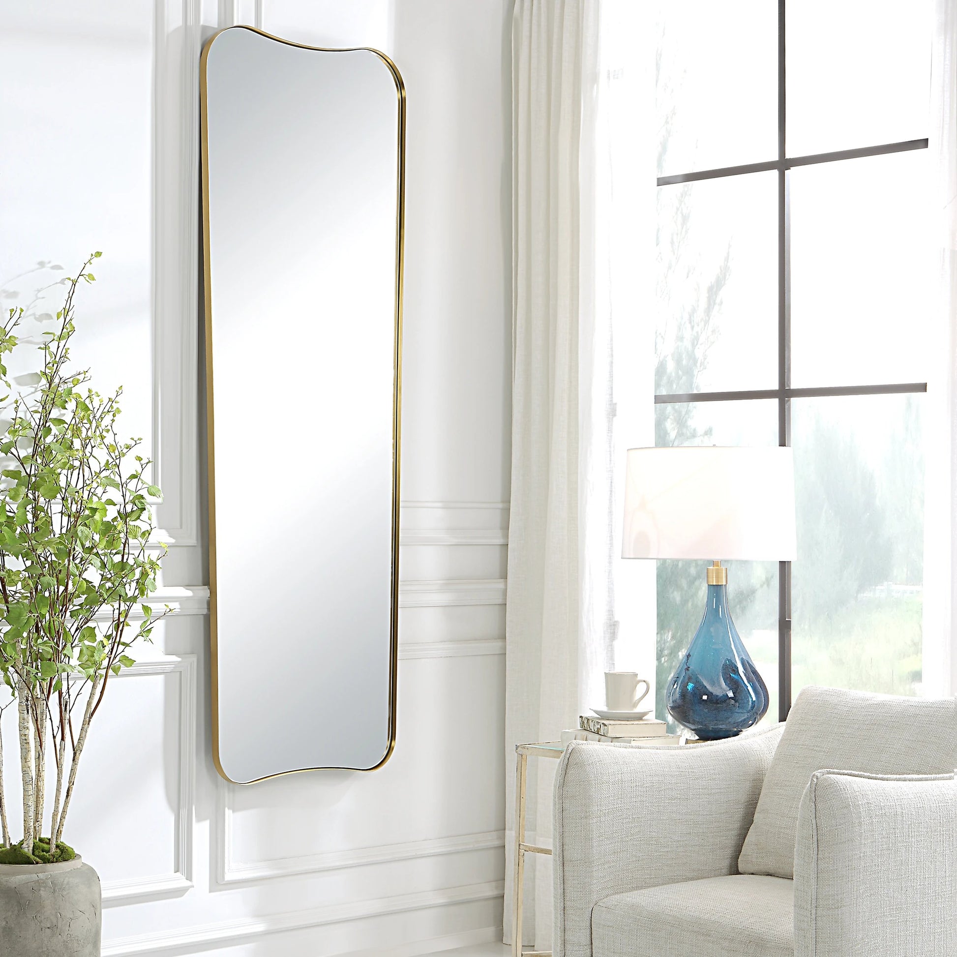 Belvoir Large Mirror by Uttermost in brass. Made from stainless steel, mdf, glass in a modern style.