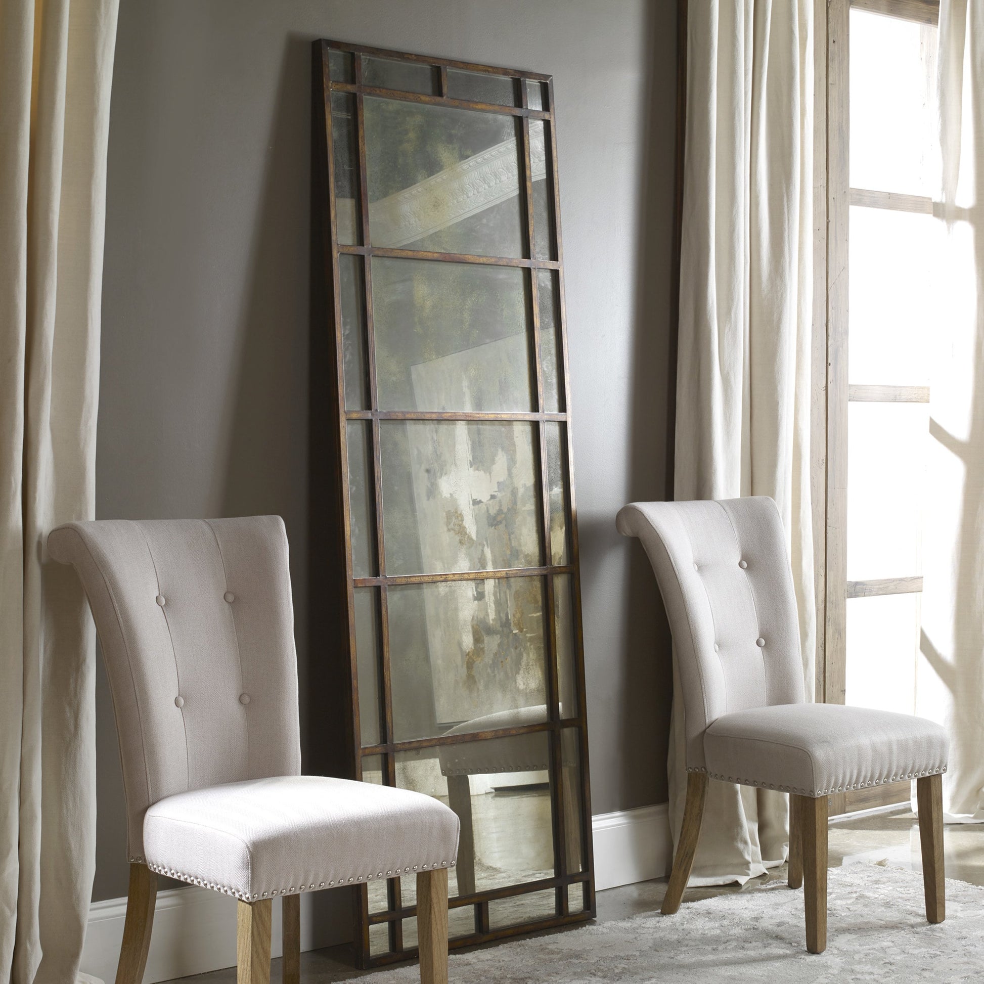 Avidan Mirror by Uttermost in gold. Made from metal in a modern style.