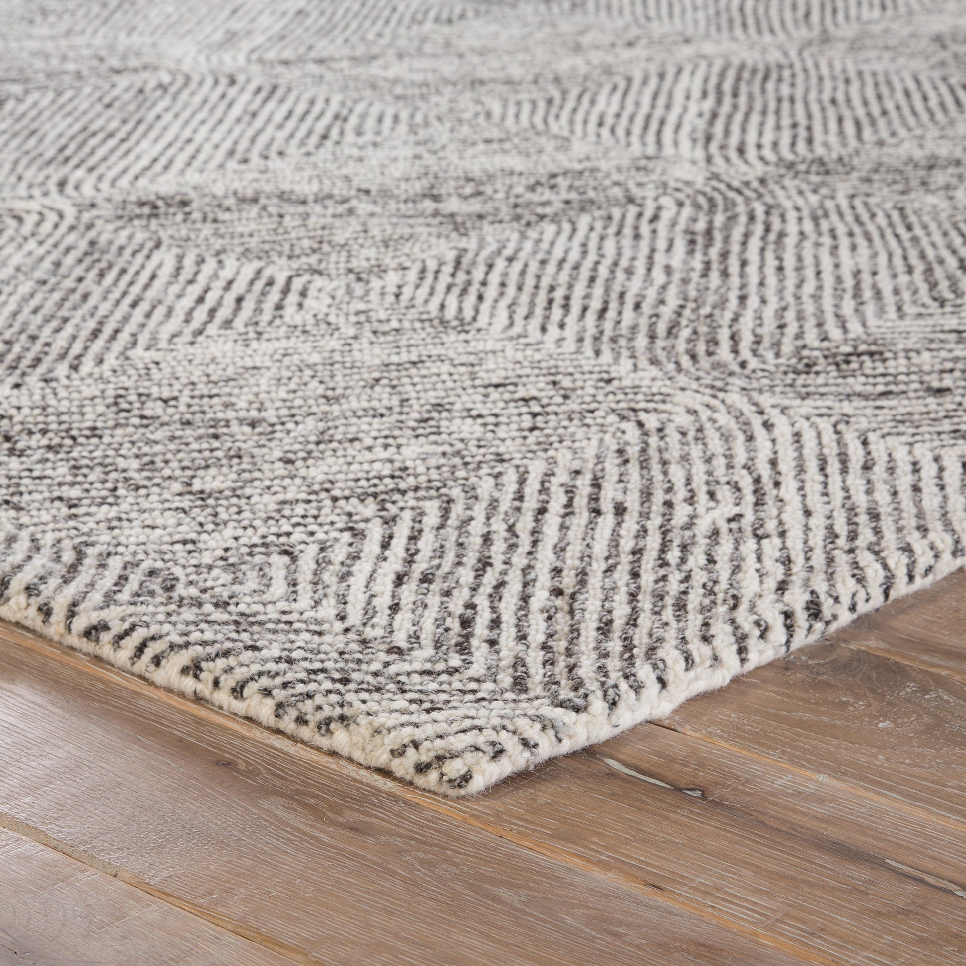 Traditions Made Modern Tufted MMT19 Rug by Jaipur Living in white, gray. Made from 100% wool in a unique style.
