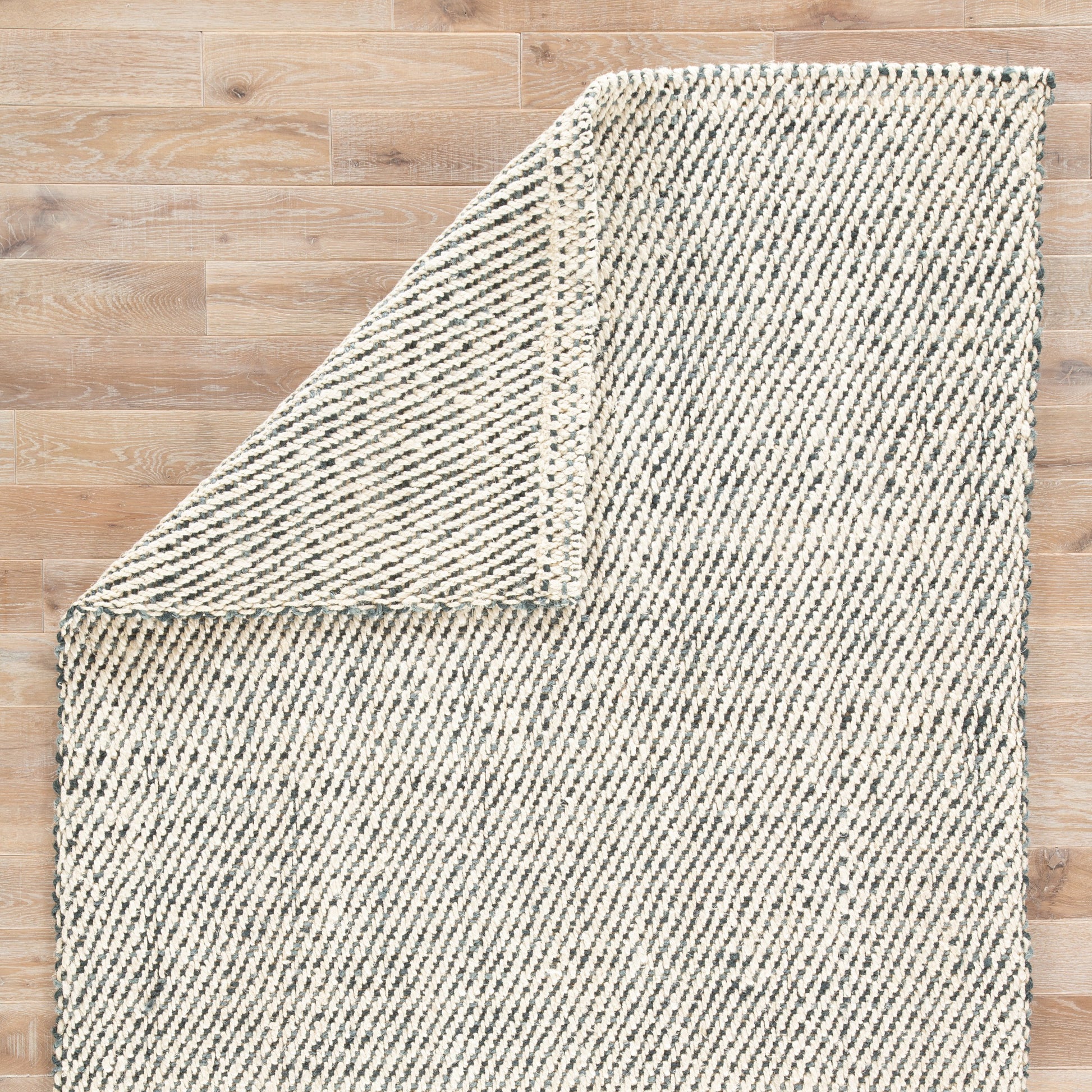 Naturals Tobago NAT26 Rug by Jaipur Living in white, black. Made from 100% jute in a unique style.