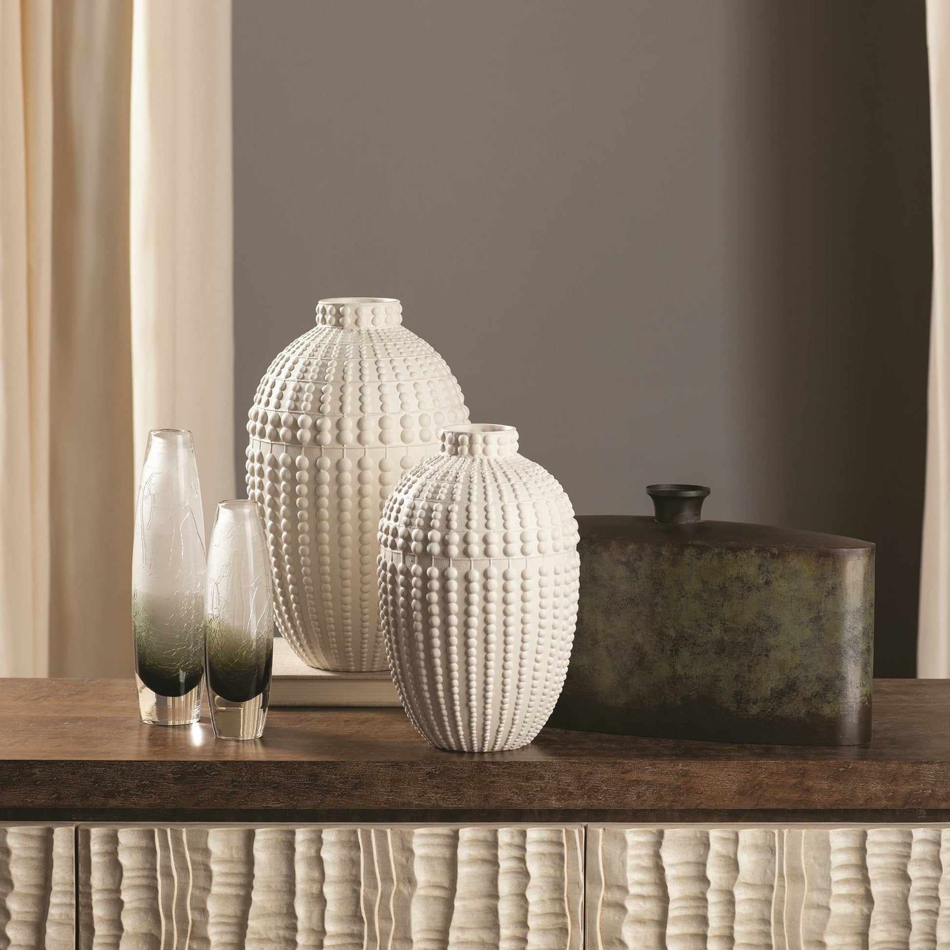Nail Head Vase by Global Views in rustic white. Made from ceramic in a coastal style.