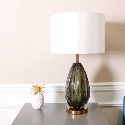 Felicia Table Lamp by Pasargad Home in gold and green. Made from glass, steel in a coastal style.