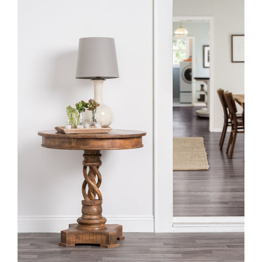 Bella Round Table by Kosas Home in honey brown. Made from mango wood in a traditional style.