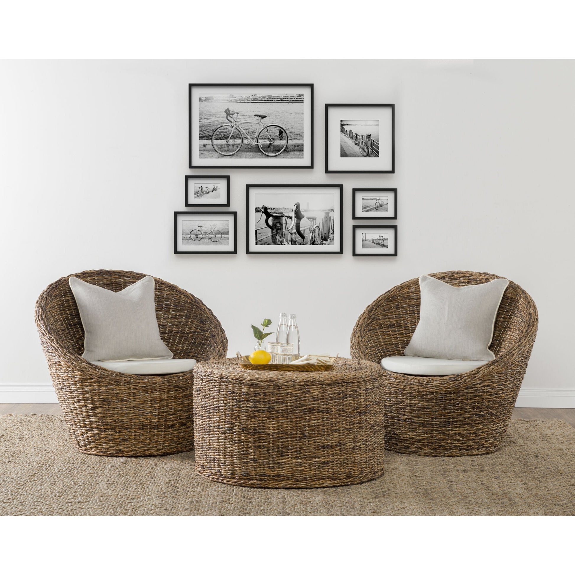 Ira Round Rattan Coffee Table by Kosas Home. Made from rattan abaca in a coastal style.