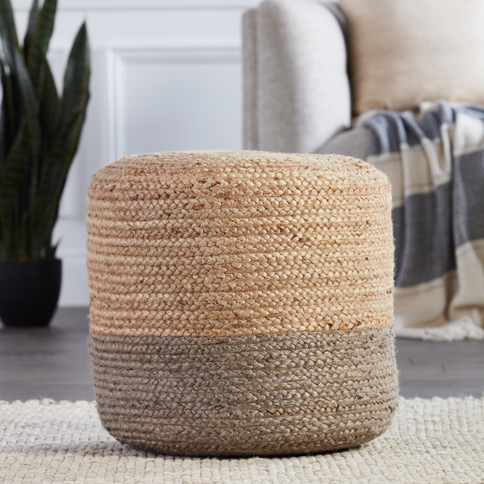 Saba Oliana 18" Pouf by Jaipur Living. Made from 100% jute in a coastal style.
