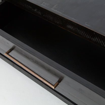 Suki Console Table by Four Hands in burnished black. Made from resawn mixed wood in a modern style.