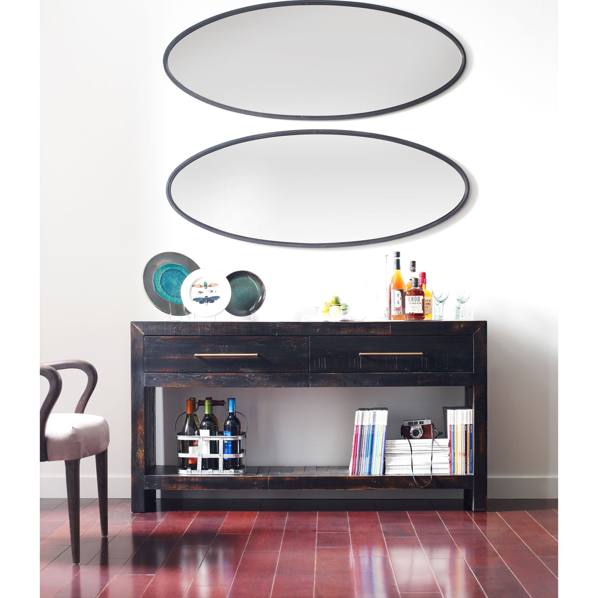 Suki Console Table by Four Hands in burnished black. Made from resawn mixed wood in a modern style.