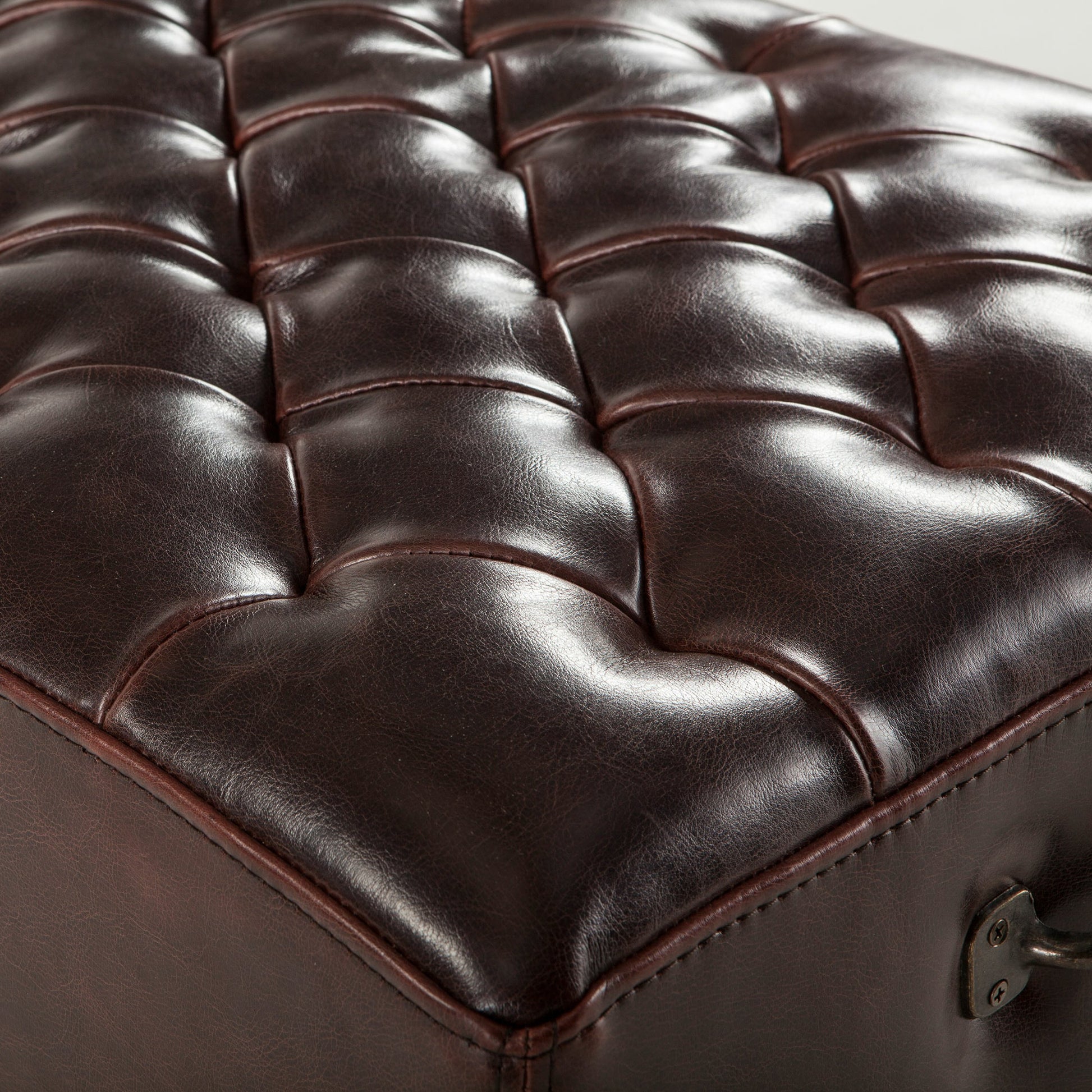 Arabella Leather Bench by World Interiors in brown and antique bronze. Made from birch wood, iron, bi-cast leather in a modern style.