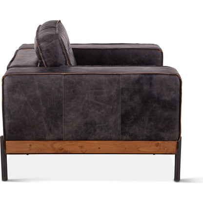 Chiavari Distressed Antique Leather Armchair by World Interiors in black and matte. Made from leather, foam, oak wood, iron in a modern style.