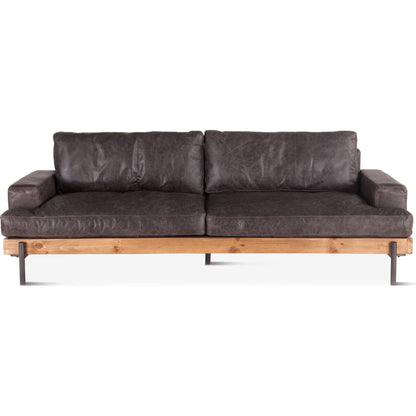 Chiavari Sofa by World Interiors in brown and distressed, antique zinc. Made from leather, iron, oak wood in a modern style.