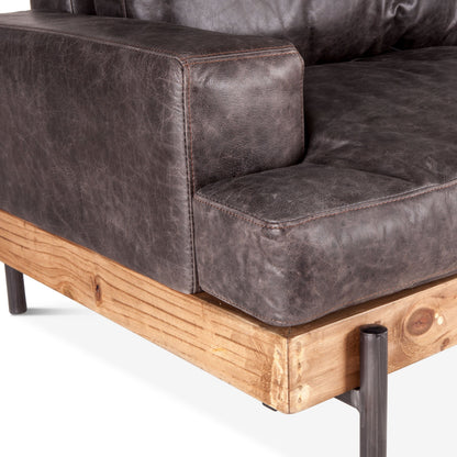 Chiavari Sofa by World Interiors in brown and distressed, antique zinc. Made from leather, iron, oak wood in a modern style.