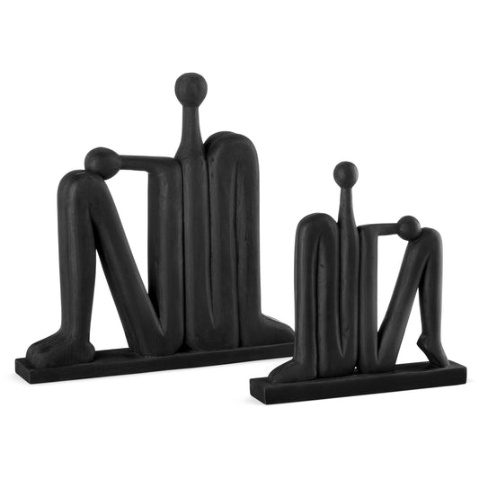 Abstract Figure Set by Currey and Company in black. Made from wood in a modern style.