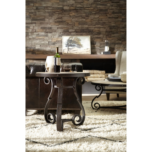Luckenbach Metal & Stone End Table by Hooker Furniture in black. Made from cast iron, antique travertine in a unique style.