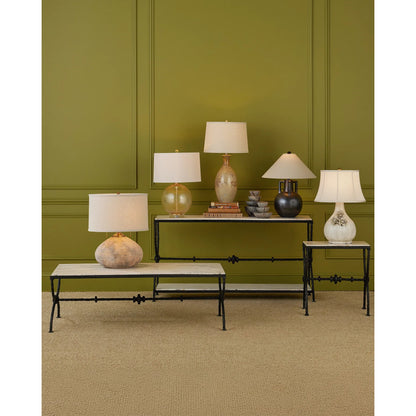 Agora White Travertine Console Table by Currey and Company in natural, rustic bronze. Made from white travertine, wrought iron in a modern style.