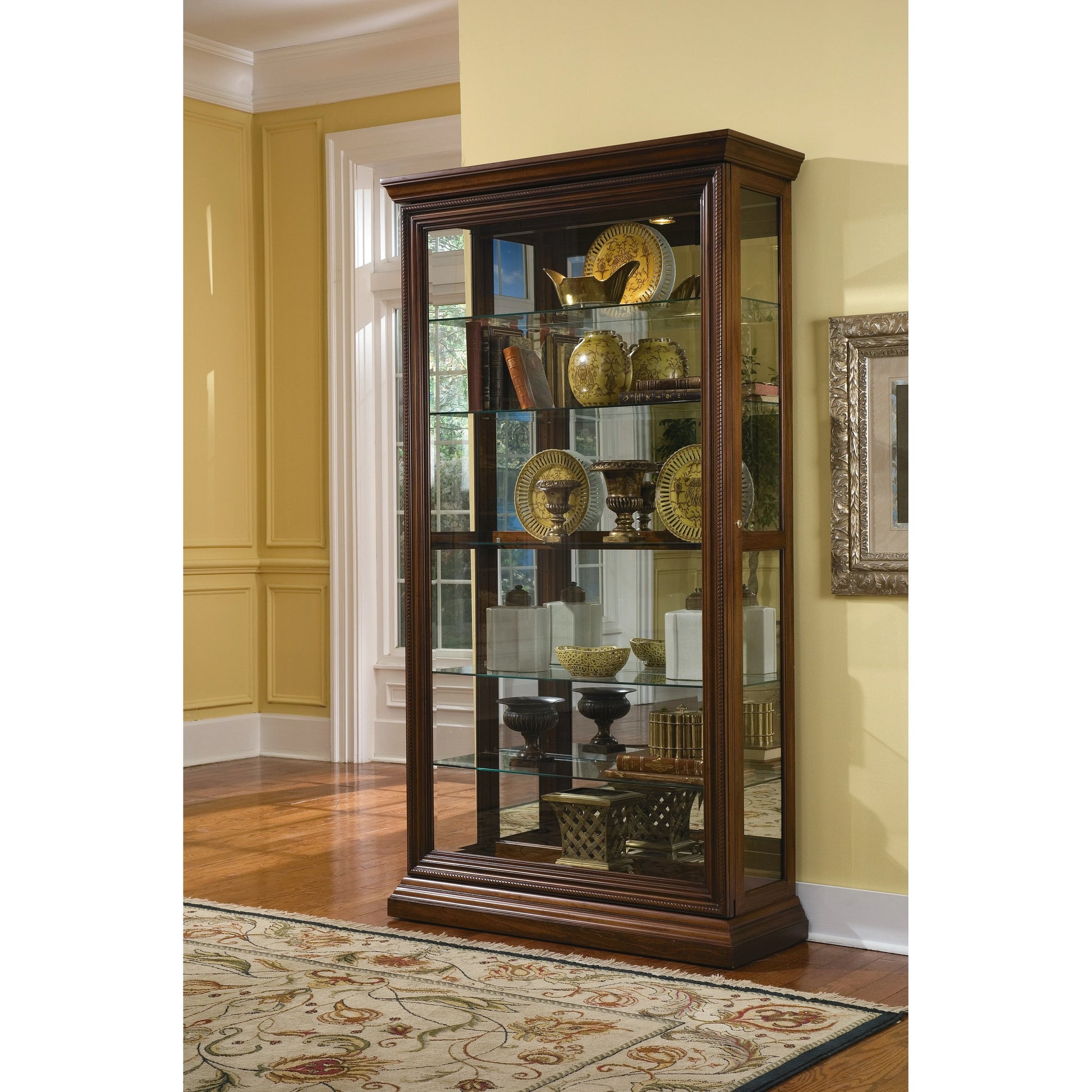 43'' Wide Hardwood Two Way Sliding Door Curio Cabinet in Rich Brown by Pulaski Furniture in rich brown. Made from poplar solids with birch veneers in a traditional style.