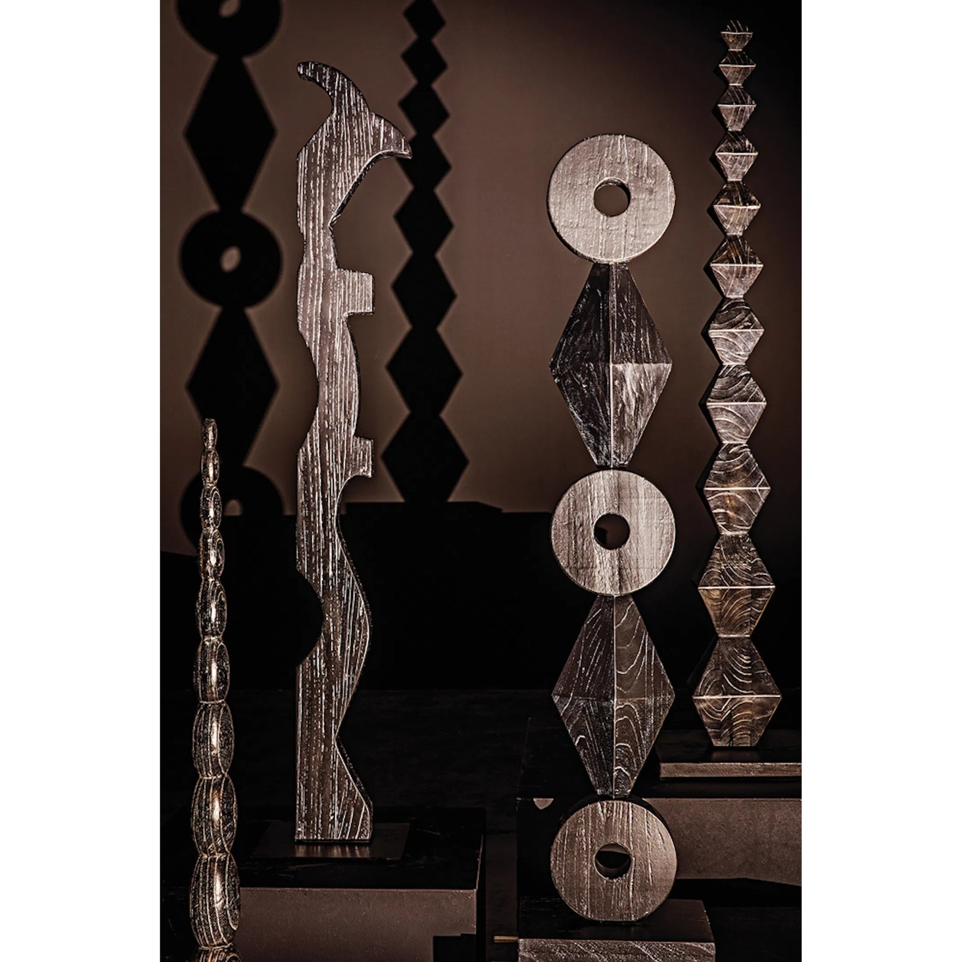 Freia Sculpture by Noir in cinder black. Made from mindi in a traditional style.