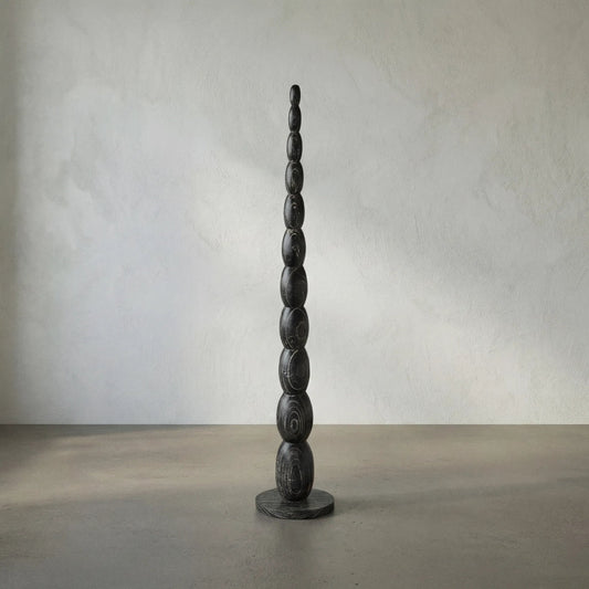 Freia Sculpture by Noir in cinder black. Made from mindi in a traditional style.