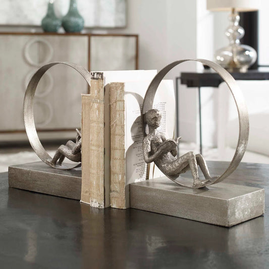 Lounging Reader Antique Bookends (Set of 2) by Uttermost. Made from metal, mdf, resin in a modern style.