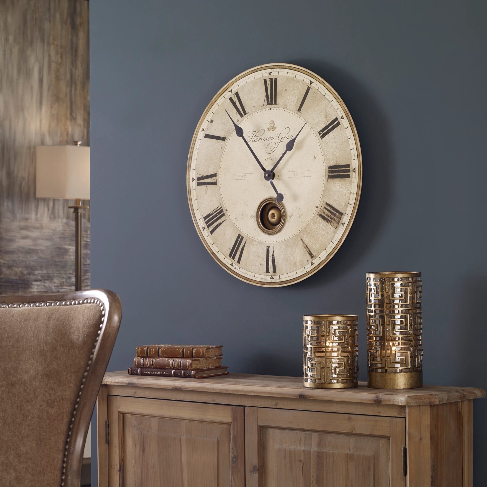Harrison Clock by Uttermost in gray. Made from mdf, brass, aluminum in a traditional style.