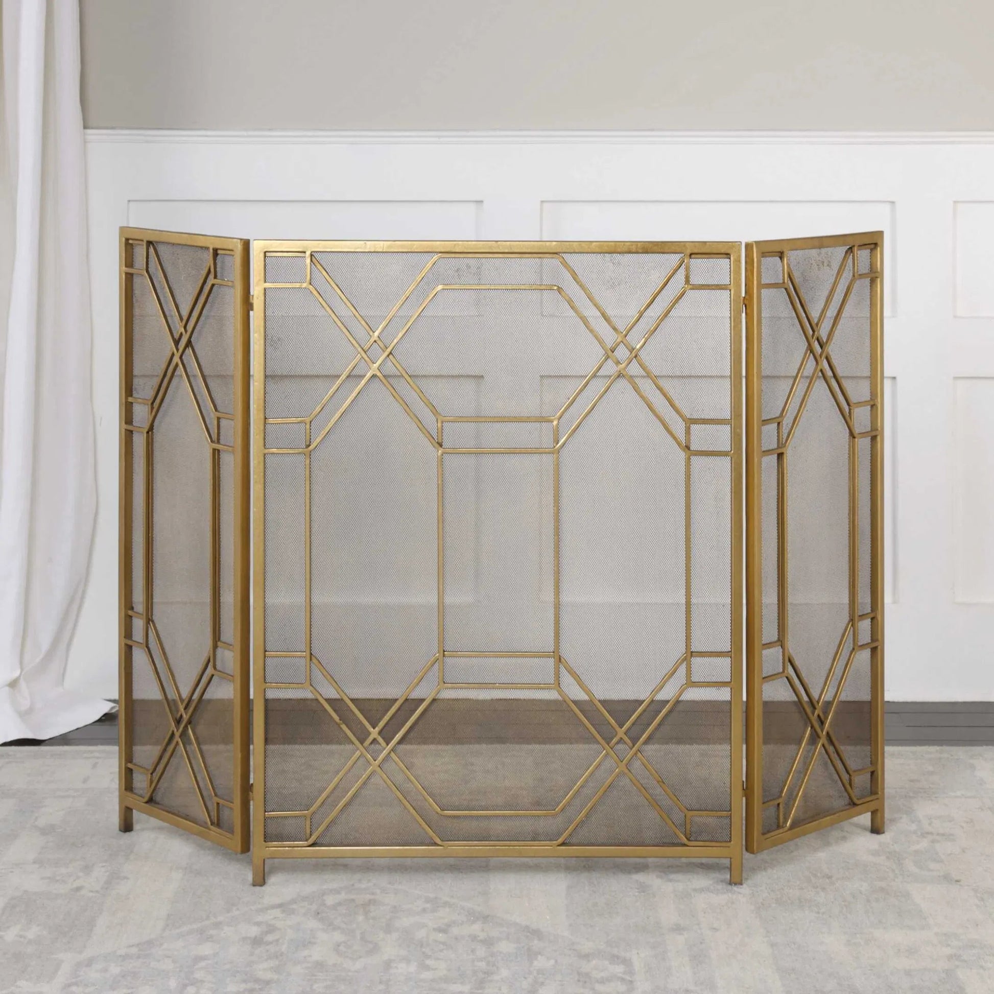Rosen Fireplace Screen by Uttermost in gold. Made from metal in a traditional style.