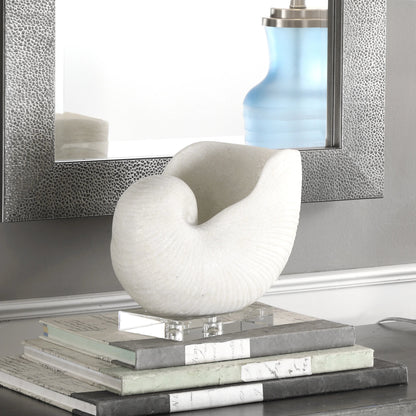 Nautilus Shell Sculpture by Uttermost. Made from polyester, crystal in a coastal style.