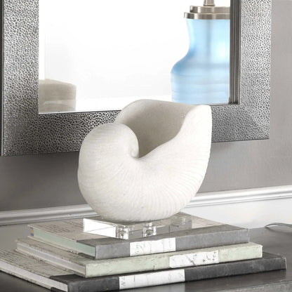 Nautilus Shell Sculpture by Uttermost. Made from polyester, crystal in a coastal style.