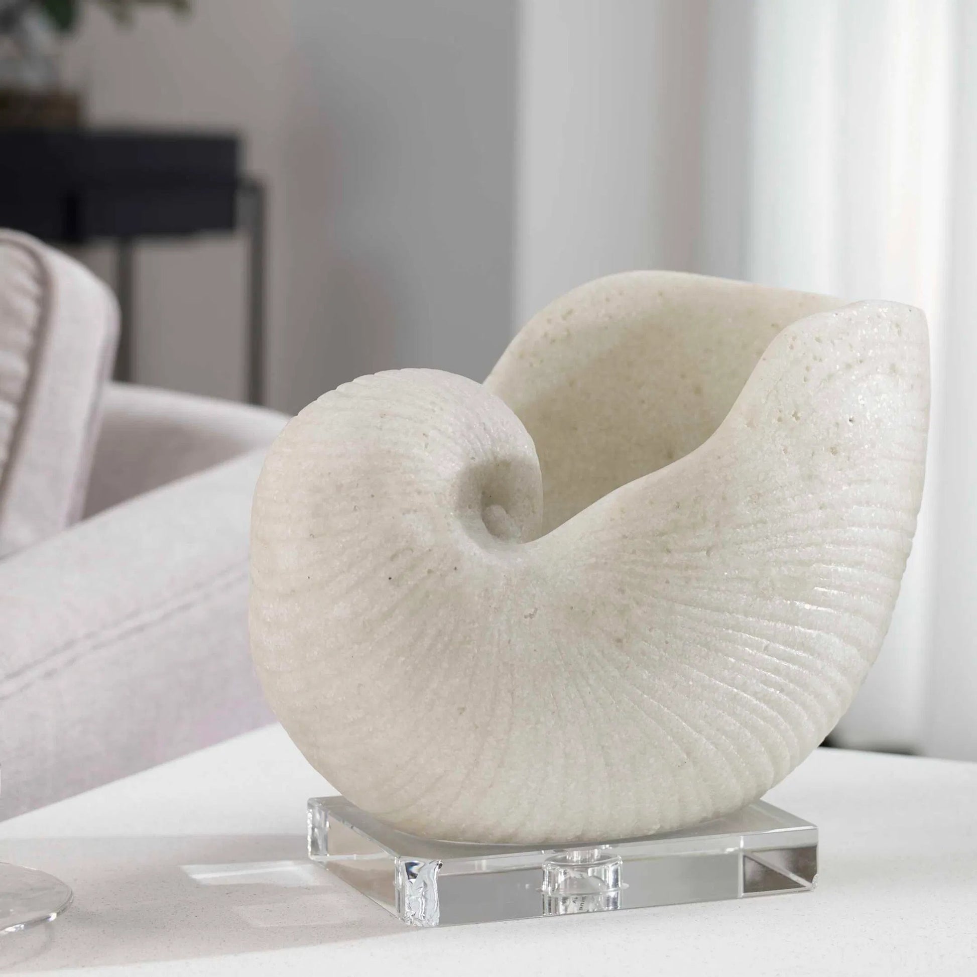 Nautilus Shell Sculpture by Uttermost. Made from polyester, crystal in a coastal style.