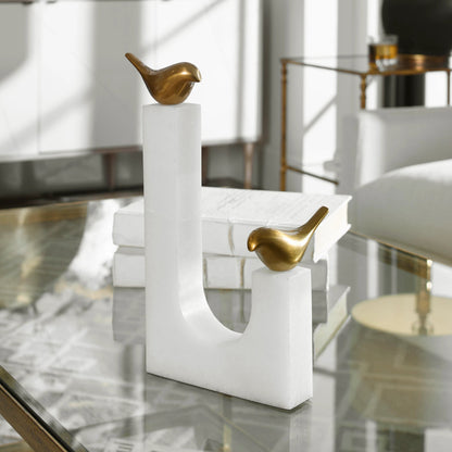 Songbirds Brass Sculpture by Uttermost in white, brushed brass. Made from brass, marble in a modern style.