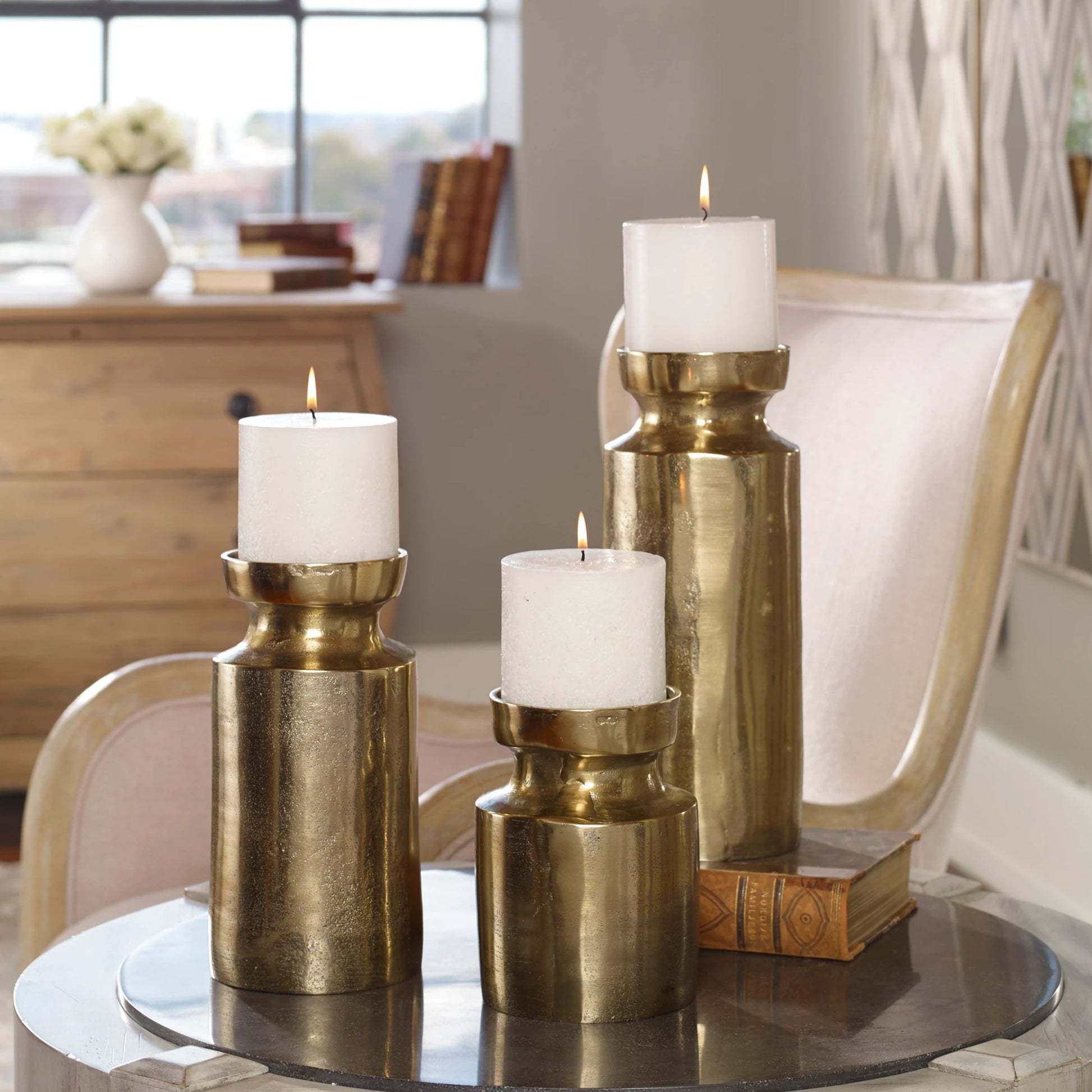 Amina Antique Brass Candleholders by Uttermost. Made from aluminum, wax in a eclectic & global style.