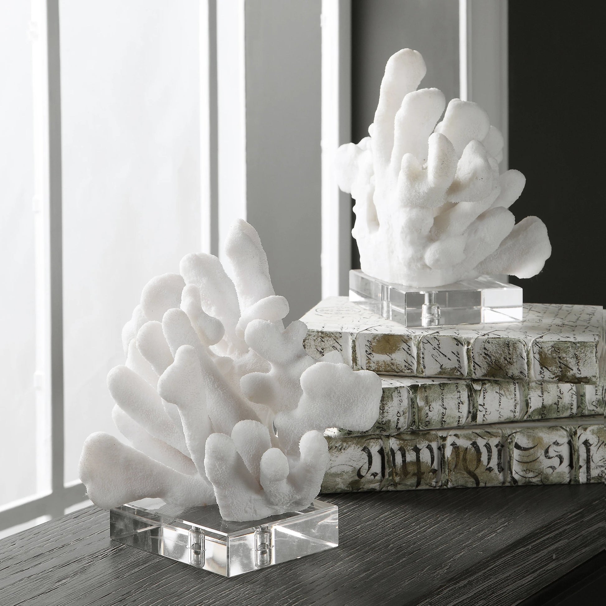 Charbel Bookends by Uttermost in white. Made from resin, k9cystal in a coastal style.