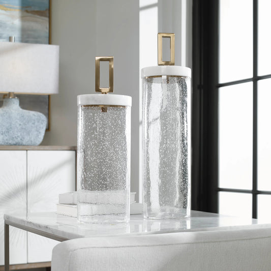 Hayworth Containers by Uttermost in white, brushed brass. Made from glass, marble, iron in a transitional style.