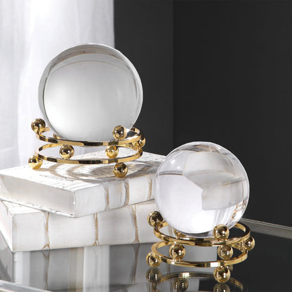 Alega Spheres by Uttermost in polished gold. Made from crystal, steel in a transitional style.