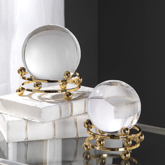 Alega Spheres by Uttermost in polished gold. Made from crystal, steel in a transitional style.