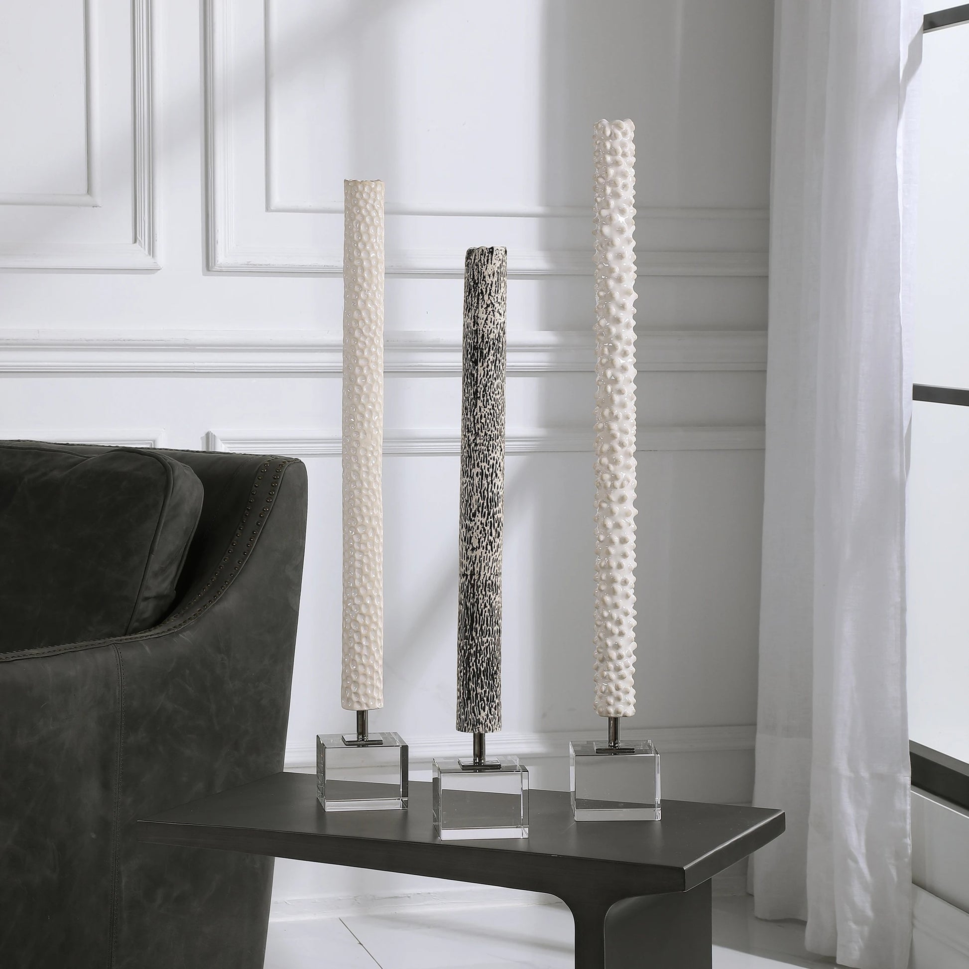 Makira Cylindrical Sculptures by Uttermost. Made from ceramic, crystal, iron in a eclectic & global style.