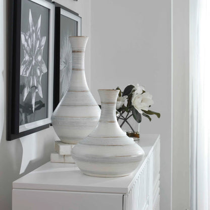 Potter Vases by Uttermost in ivory. Made from earthenware in a traditional style.