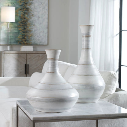 Potter Vases by Uttermost in ivory. Made from earthenware in a traditional style.