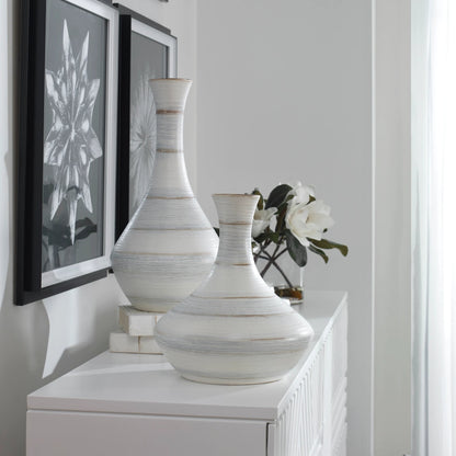 Potter Vases by Uttermost in ivory. Made from earthenware in a traditional style.