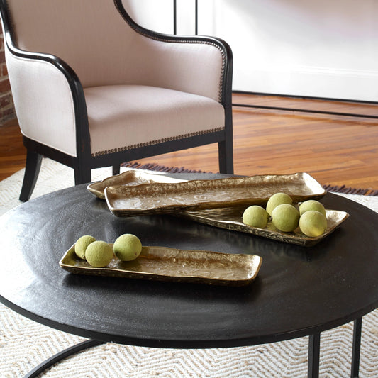 Artisan Trays by Uttermost in gold. Made from aluminum in a transitional style.
