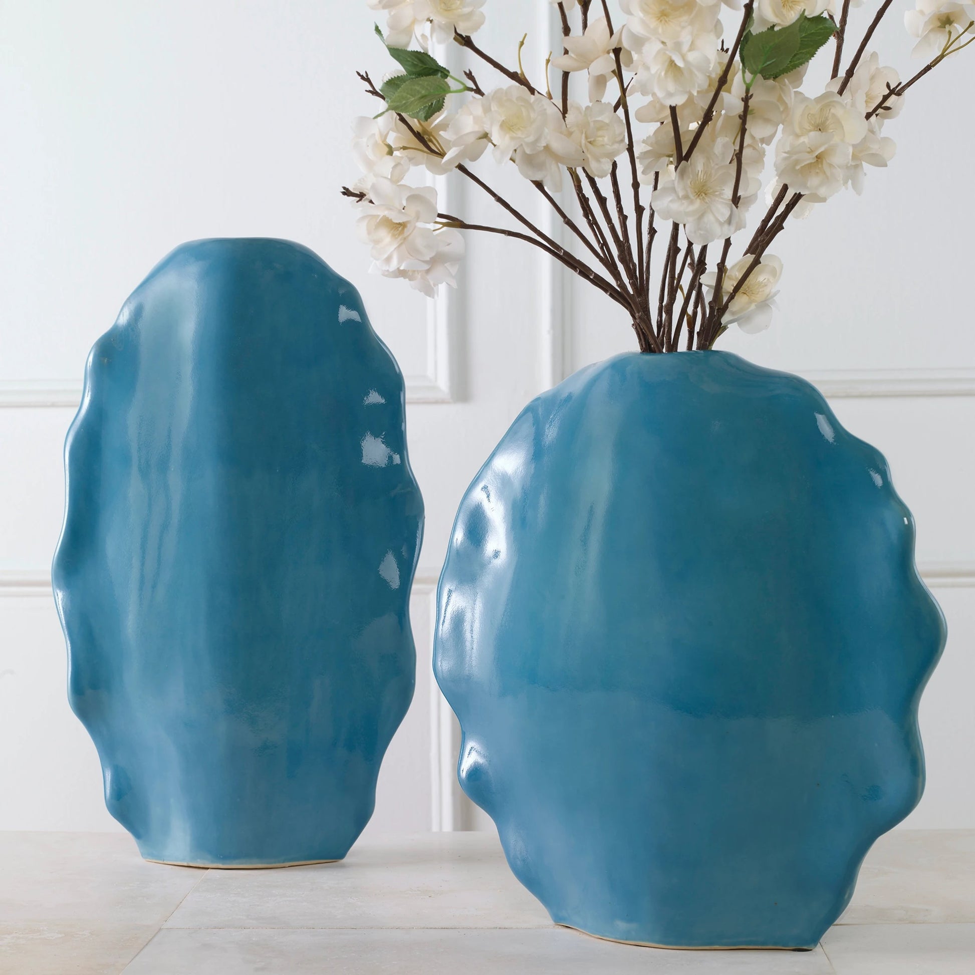 Ruffled Feathers Vases by Uttermost. Made from earthenware in a transitional style.