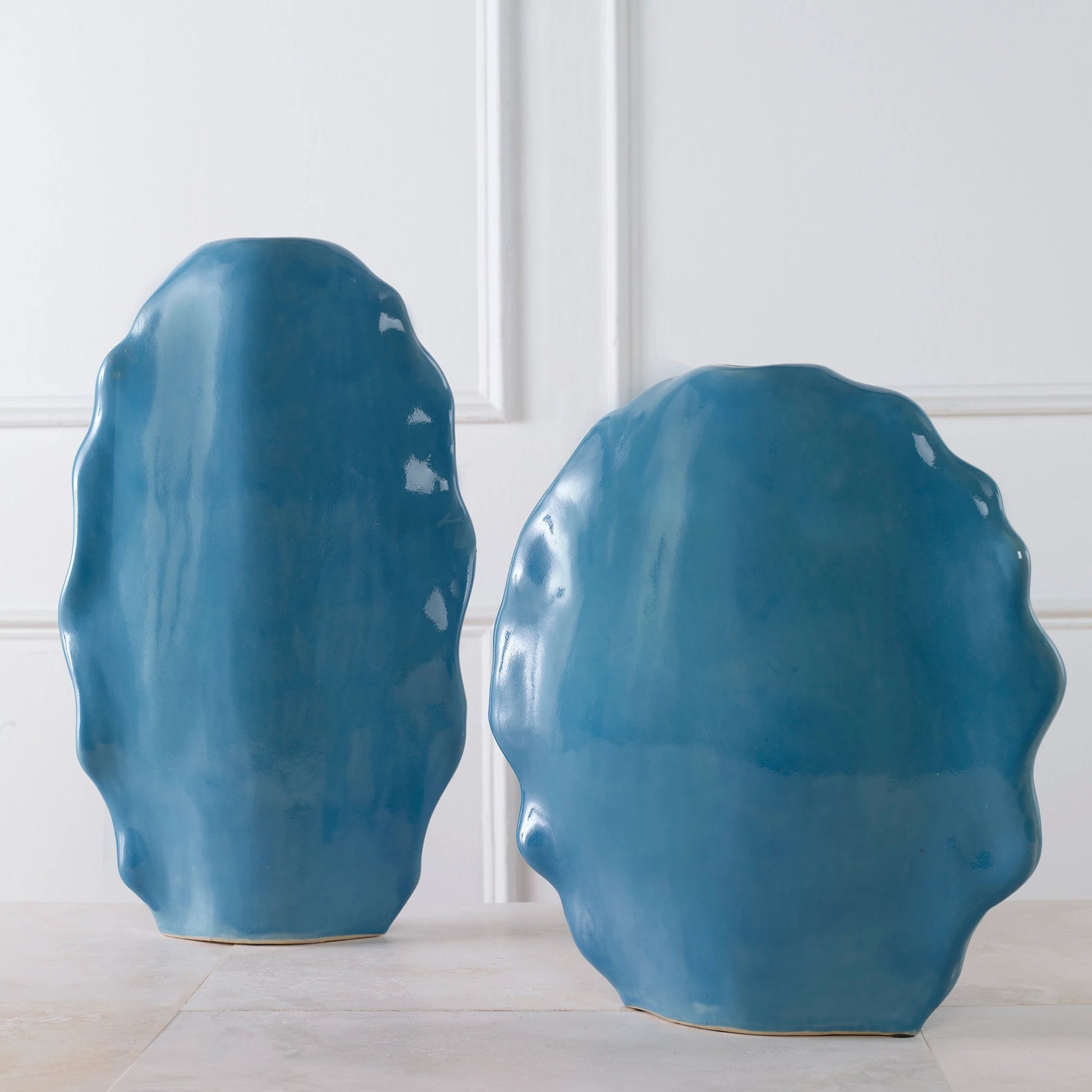 Ruffled Feathers Vases by Uttermost. Made from earthenware in a transitional style.