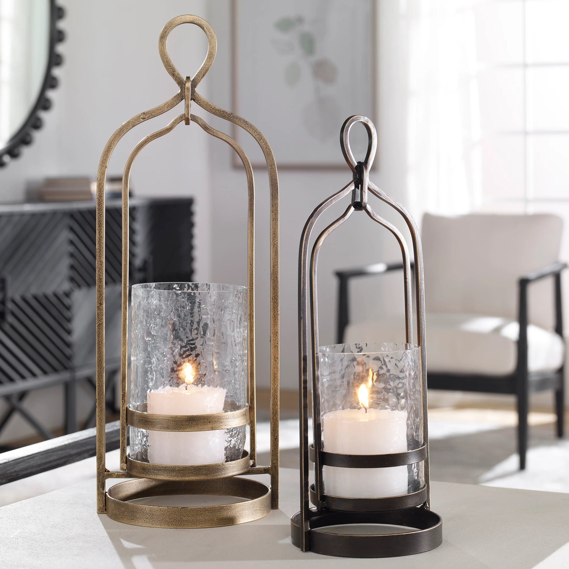 Shepherd Candleholder by Uttermost in dark bronze. Made from iron, glass in a modern style.