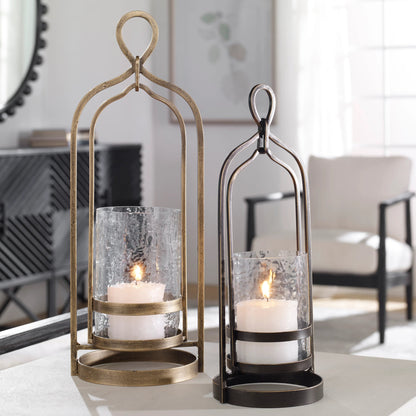 Shepherd Candleholder by Uttermost in dark bronze. Made from iron, glass in a modern style.