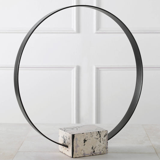 Around Again Circular Sculpture by Uttermost in satin black. Made from stone, metal in a modern style.